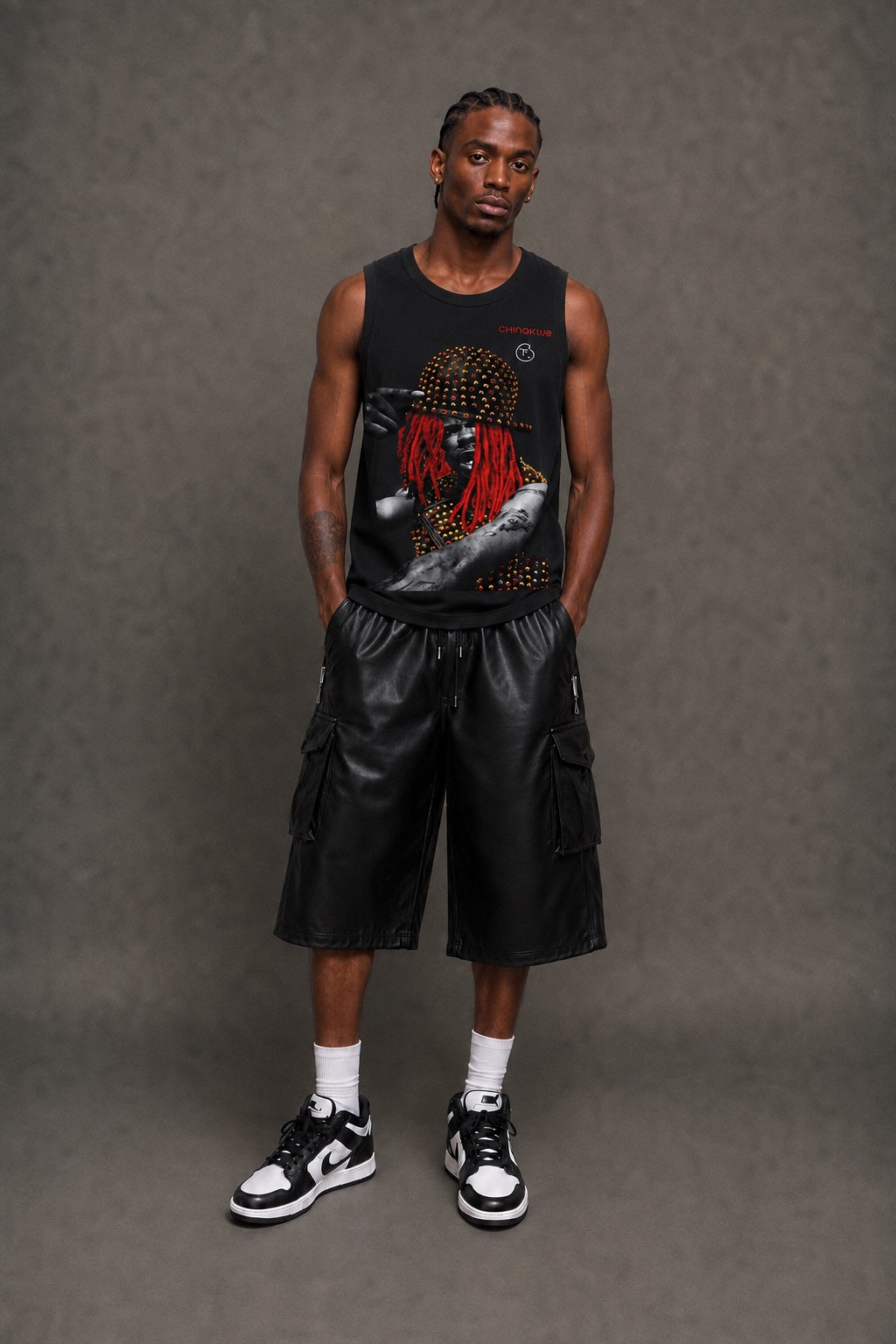 Male model wearing CHINAKWE BUSTA black tank top