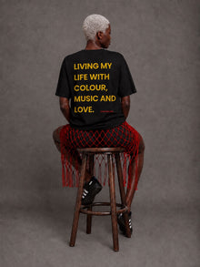 Female model showing back of CHINAKWE Live Life Red T-shirt