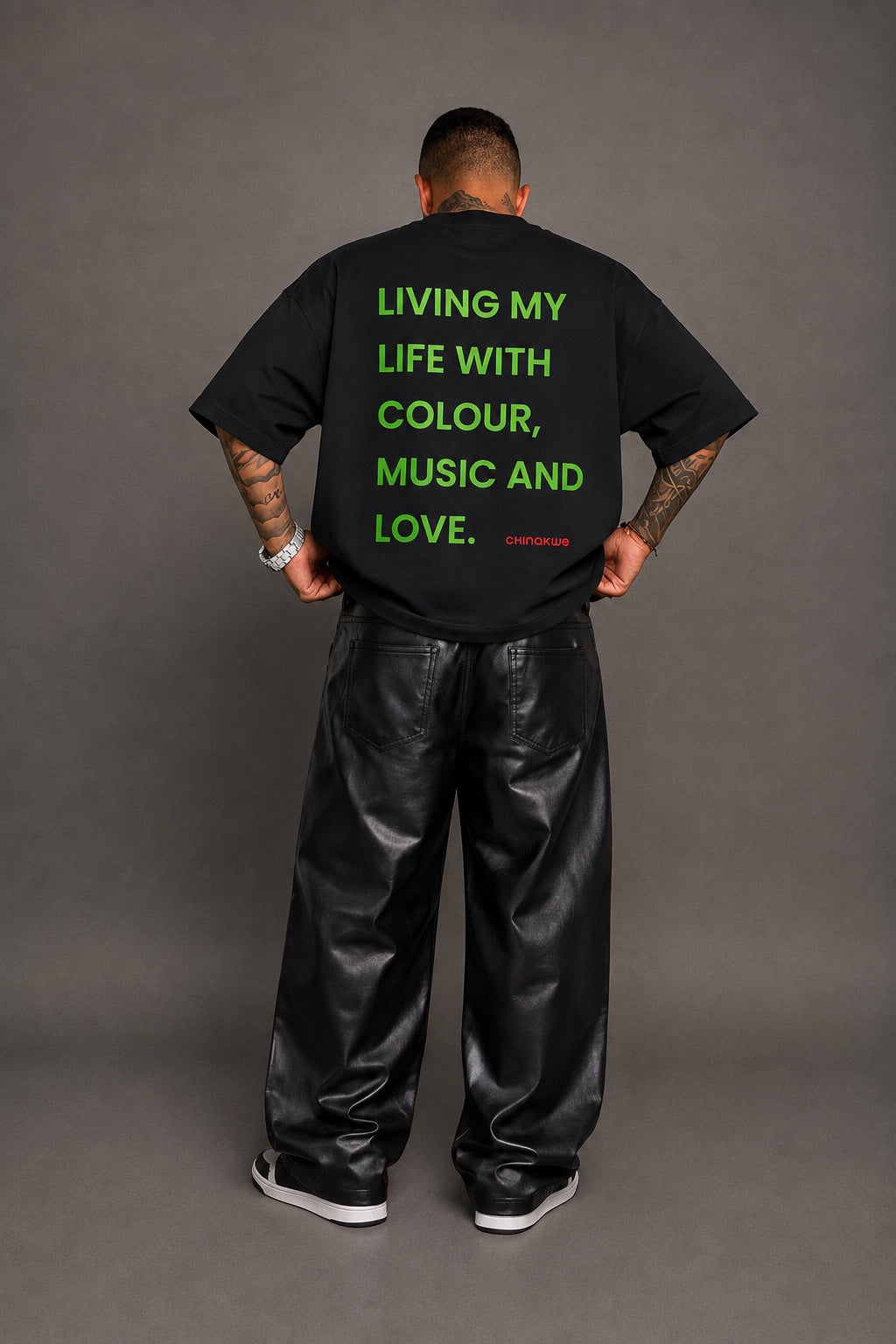 Model showing back of CHINAKWE Live Life Yellow black T-shirt