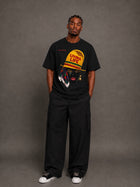 Male model wearing CHINAKWE Live Life Yellow black T-shirt